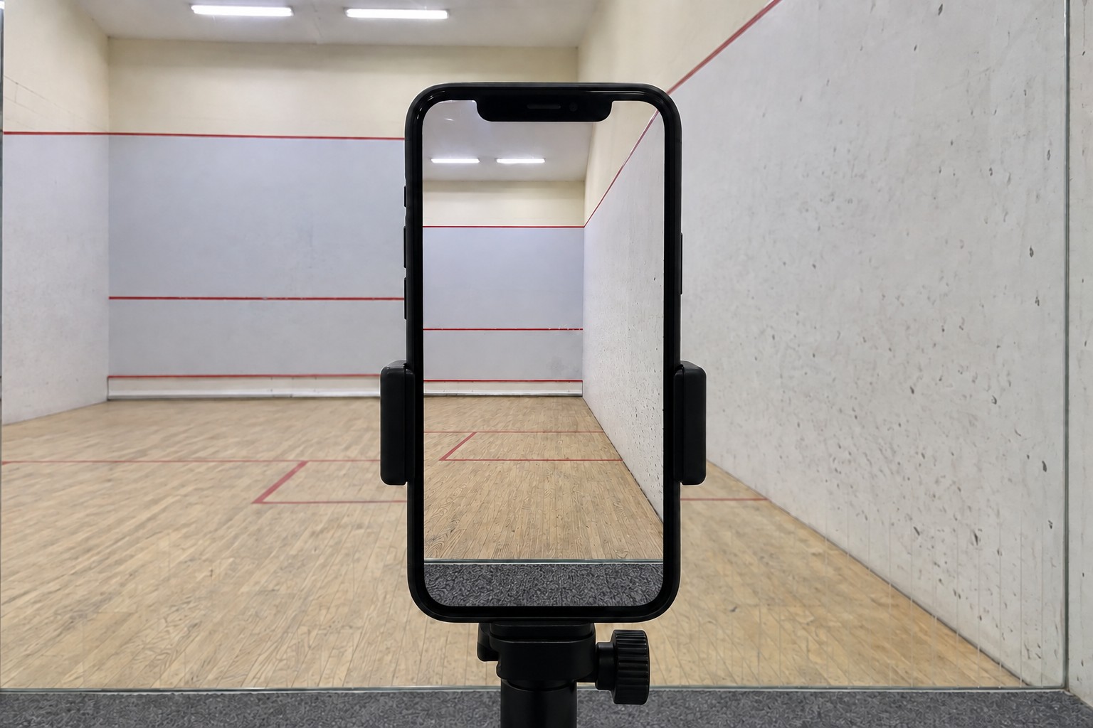 Actual portrait session framing, with a broad front-wall view, right service box and right-side floor strip.
